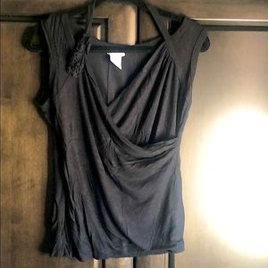 Pretty faux wrap tank with small flower embellishment